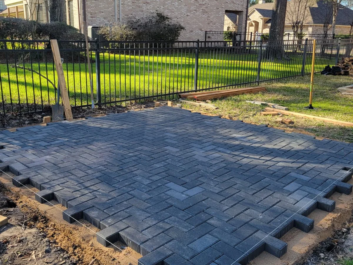Brick paver patio being laid on a compacted base